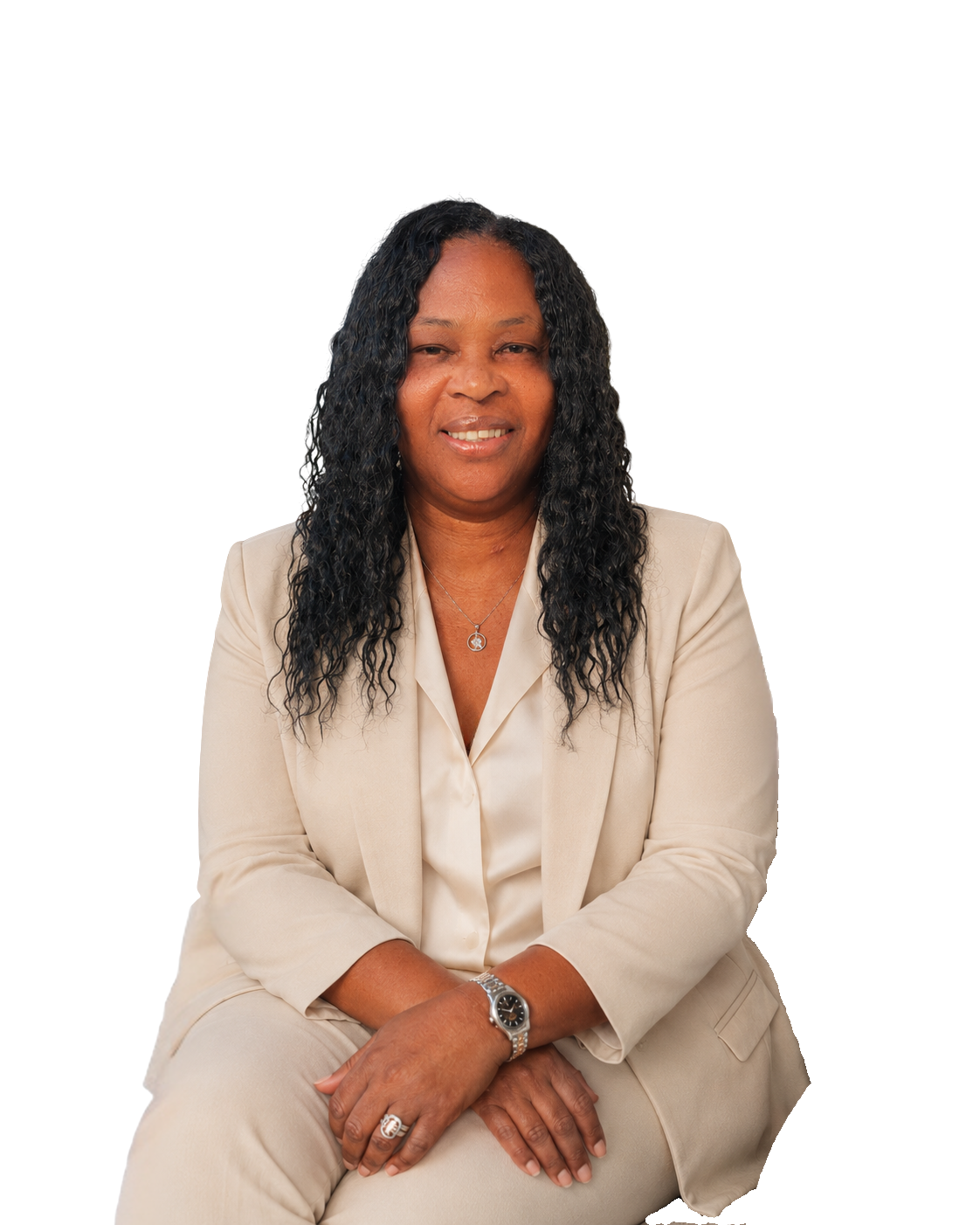 Seated portrait of Lornette Daye in an ivory blazer.